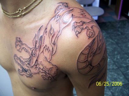 Dragon Pic Of Tattoo On Chest And Shoulder