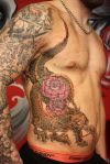 dragon and flower pic tattoo on rib