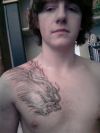 dragon pic tattoo on chest of guy