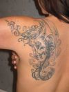 dragon pic tattoo on left shoulder blade of girl