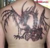 dragon skeleton tattoo on back