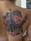 flower and dragon tattoo on back
