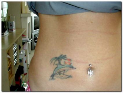 Dolphin Girl's Stomach Tattoo 