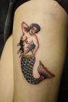 mermaid image tattoo on leg