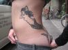 mermaid tattoo on girl's hip