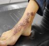 daisy flower vine tattoo on ankle