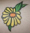 yellow daisy flower tattoo