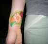 flower tattoo on wrist
