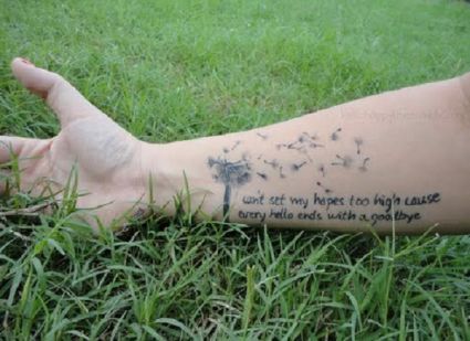 Dandelion Flower And Text Tattoo On Arm