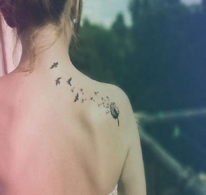 Dandelion Flower Tattoo On Back Of Girl