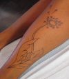 dandelion flower tattoo on leg