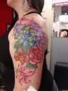 Flower tat design on shoulder