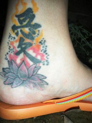 Lotus And Chinese Symbol Tattoo