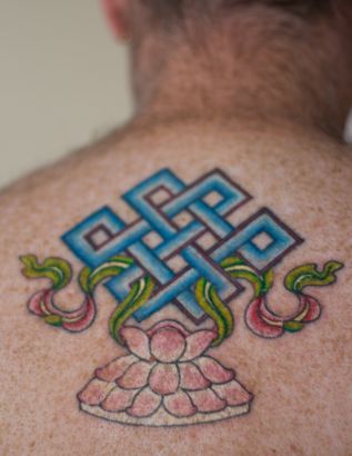 Lotus Tattoo On Man's Back