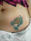 lotus tats on lower stomach