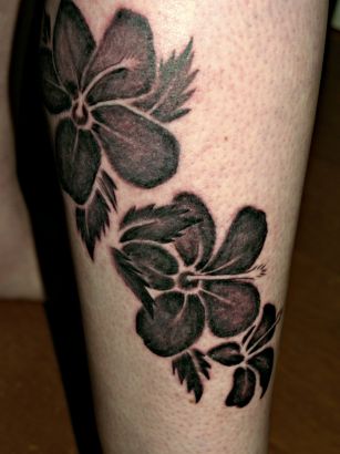 Black Flower Tattoo On Leg