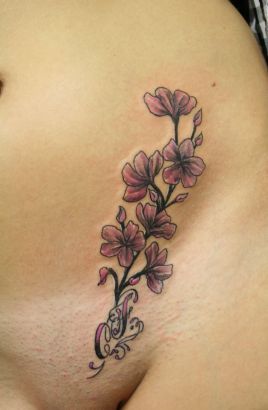 Flower And Chicano Letter Tattoo