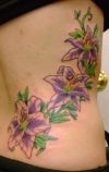 flower side rib tattoo
