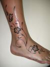 flower tattoo design on ankle