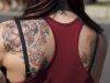 flower tattoo on left shoulder