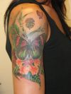 tropical flower and butterfly tattoo