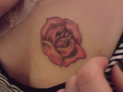 Rose Tats On Girl's Chest