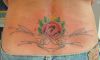 rose tattoo on girl's lower back
