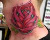 Rose tattoo on neck