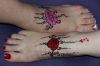 Rose tattoo on feet