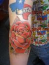 rose tattoo on elbow