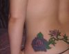 rose tats on girl's upper hip