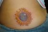 sunflower pic tattoo on upper hip