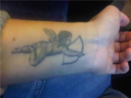 Angel Boy Wrist Tattoo