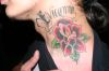 rose tat on neck