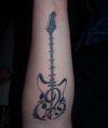 guitar tattoo on hand