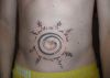 circle tattoo on stomach