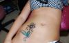girls abdomen tattoo