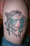 girl tattoo on thigh