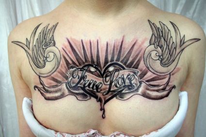 Hear Tattoo On Women's Chest.