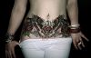 Woman stomach beautiful tattoo design