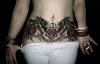 Woman stomach beautiful tattoo design
