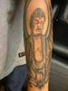 tattoo buddha on arm