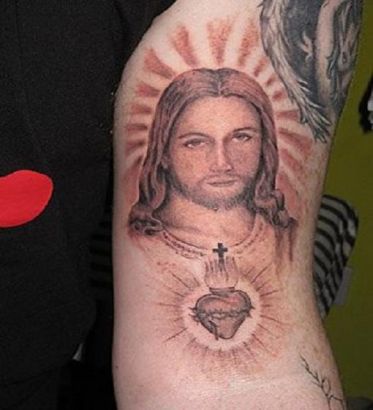 Jesus And Small Tattoo On Heart