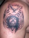 jesus and flying dove tattoo on arm