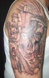 jesus image tattoo on right arm