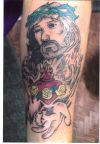 jesus image tattoos on arm