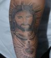 jesus pics tattoos on arm