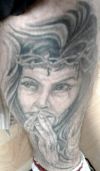 jesus picture tattoo on leg