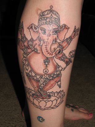 Ganesh On Flower Tattoo On Leg