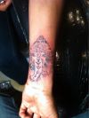 ganesha pic tattoo on wrist